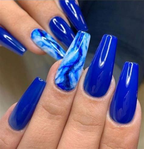 I created these bright long royal blue l, real and neon yellow . . Acrylic nails blue